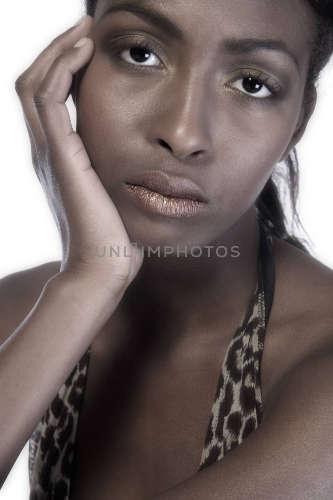 A beauty portrait taken from an african model in the studio looking pensive