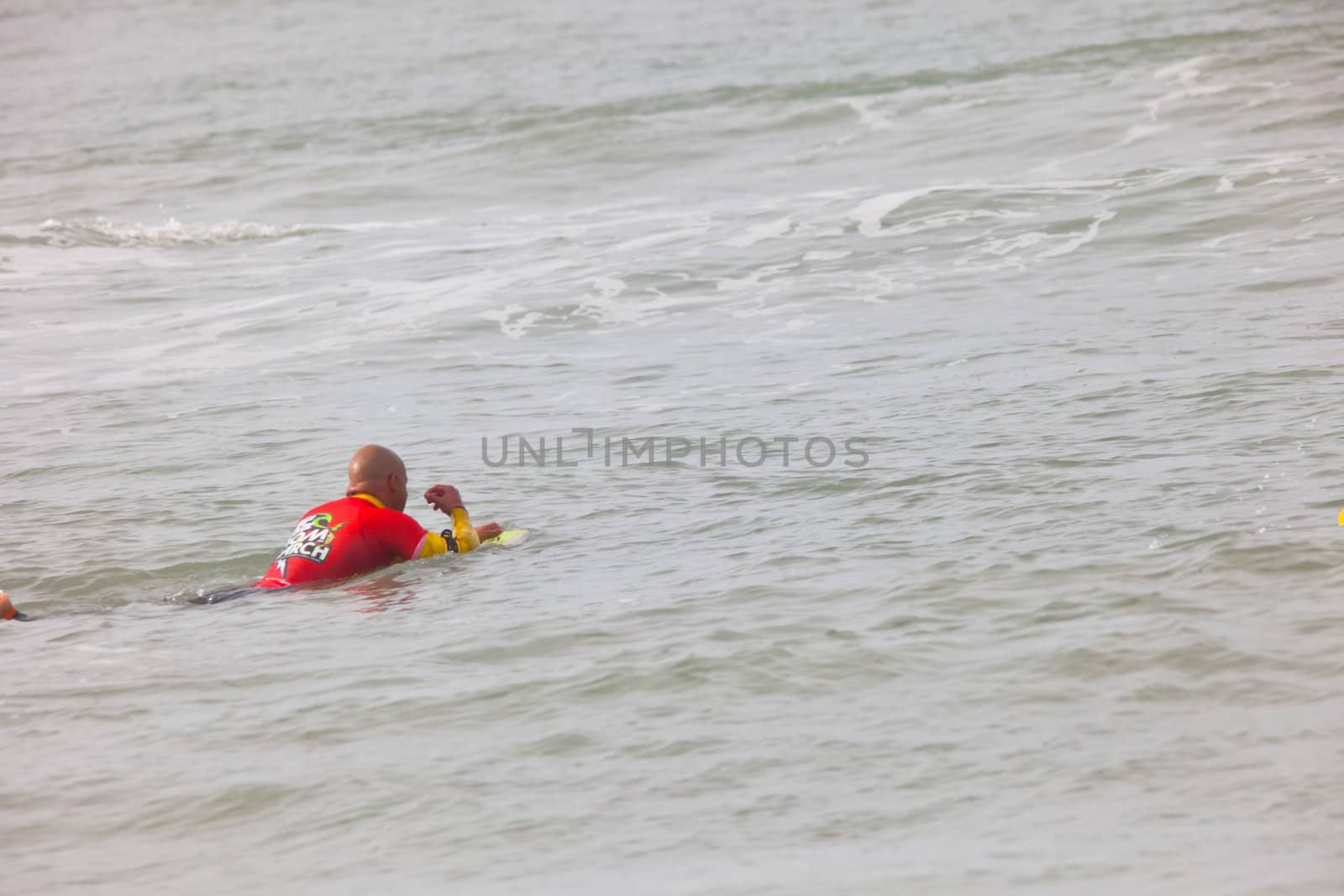 SAN FERNANDO, CADIZ, SPAIN - FEB 19: Unknown bodyboader taking waves on the 2nd championship of Surf and BodyBoard Impoxibol on Feb 19,2011 on the beach of Camposoto of San Fernando, Cadiz, Spain
