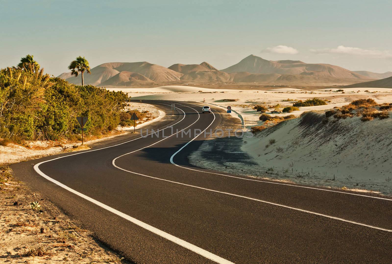 Winding road across the dunes of Corralejo, Fuerteventura, in the Canary Islands, Spain.