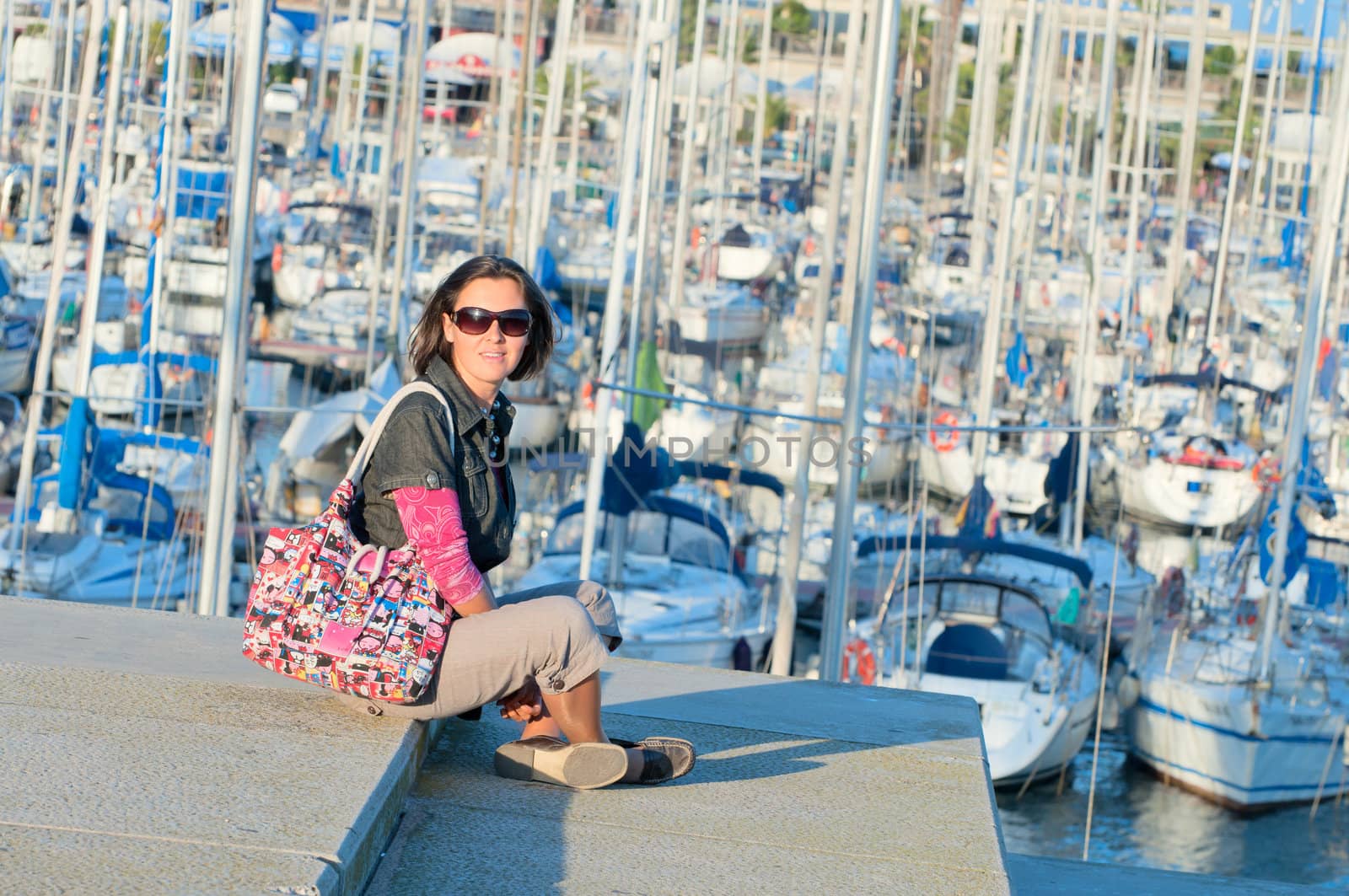 Portrait of woman in the background of yachts by maxoliki