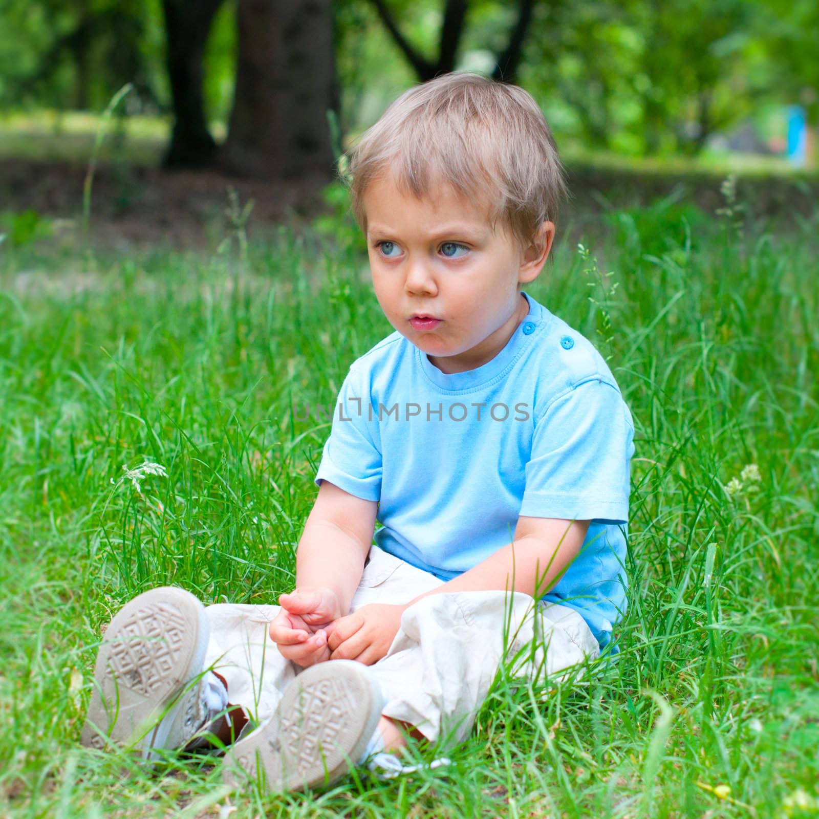 Boy in the park by maxoliki