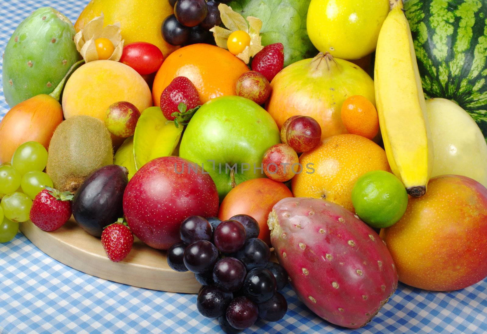 Exotic Fruit Mix on Wooden Board and Tablecloth