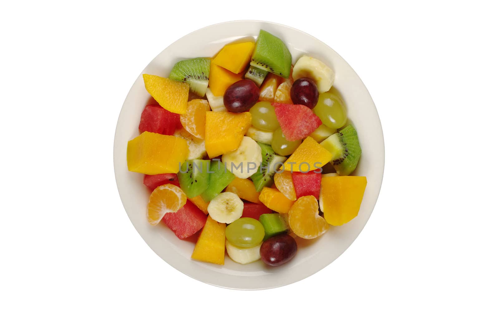 Tropical fruit salad on white plate on white background photographed from above (Isolated) 