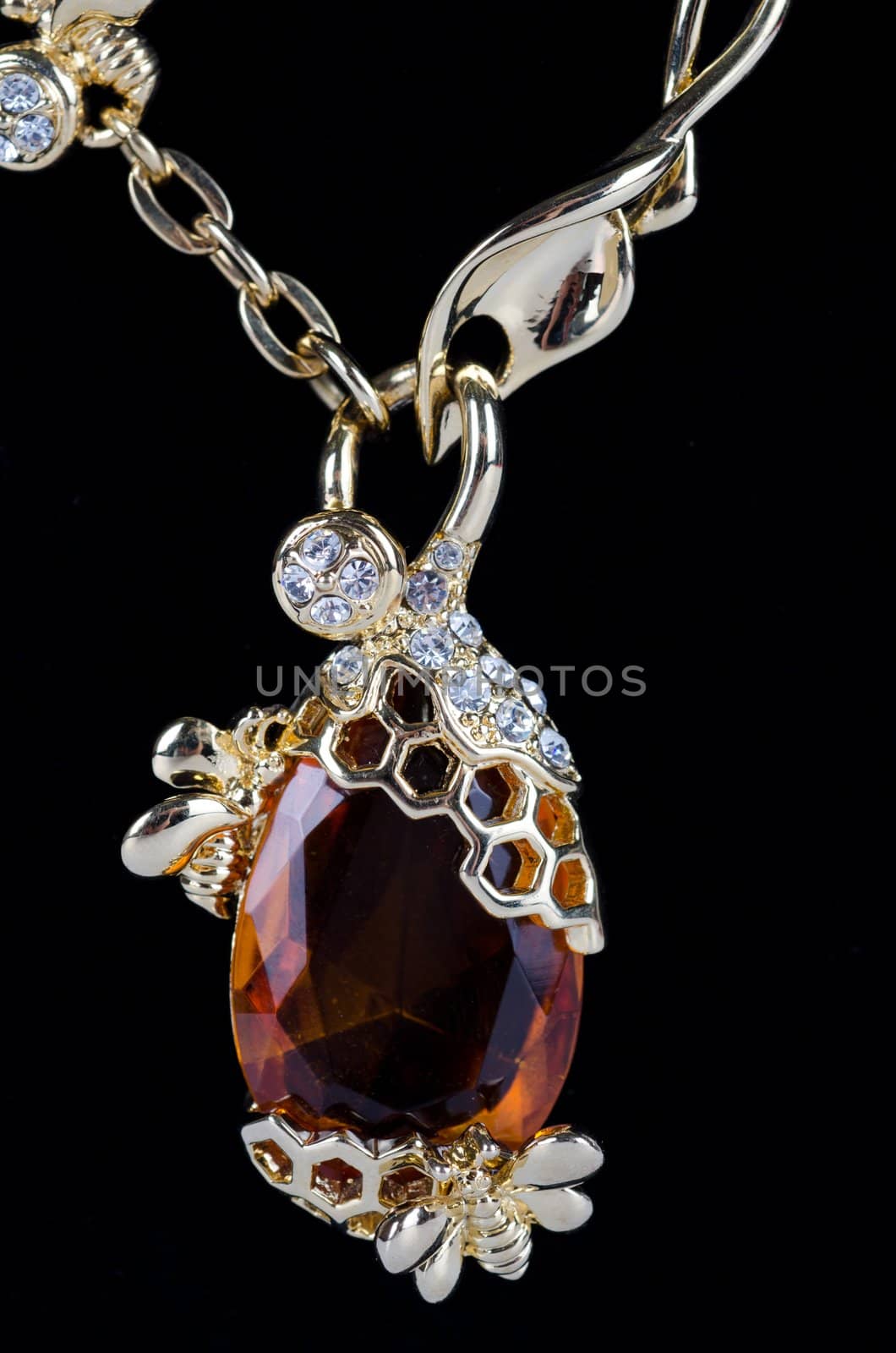 pendant closeup with big gem at black background