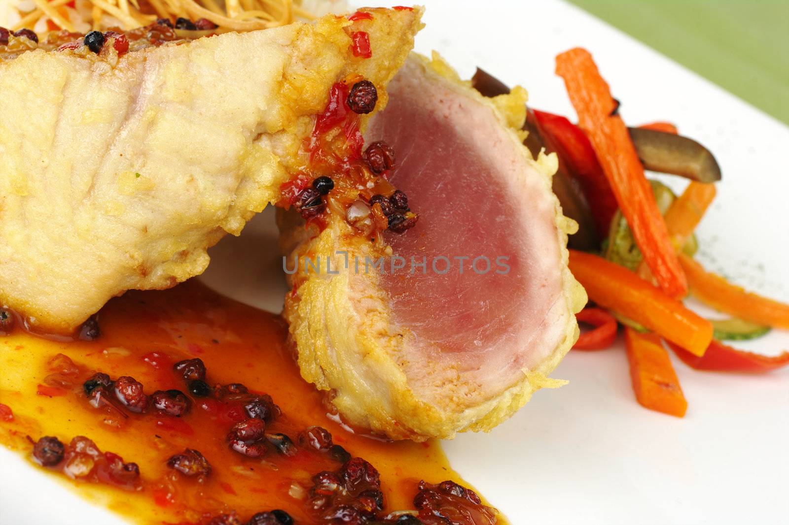 Main dish: Raw tuna fish with pepper gravy and vegetables (Selective Focus) 