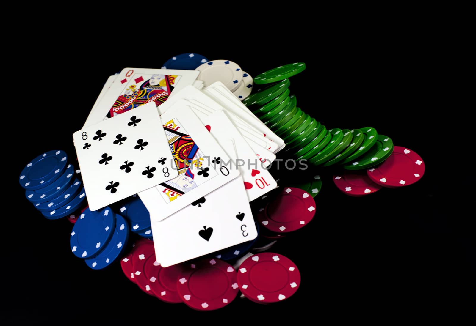 poker chips and cards on black background