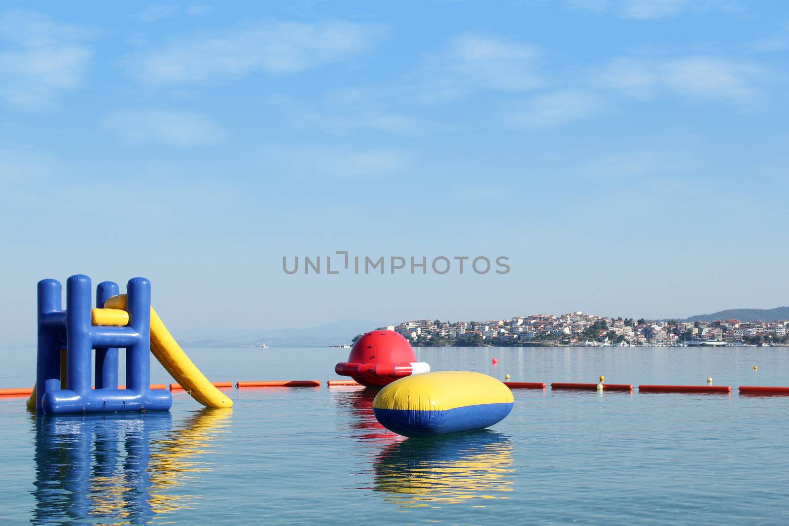 beach toys and equipment floating on sea Neos Marmaras Sithonia Halkidiki Greece by goce