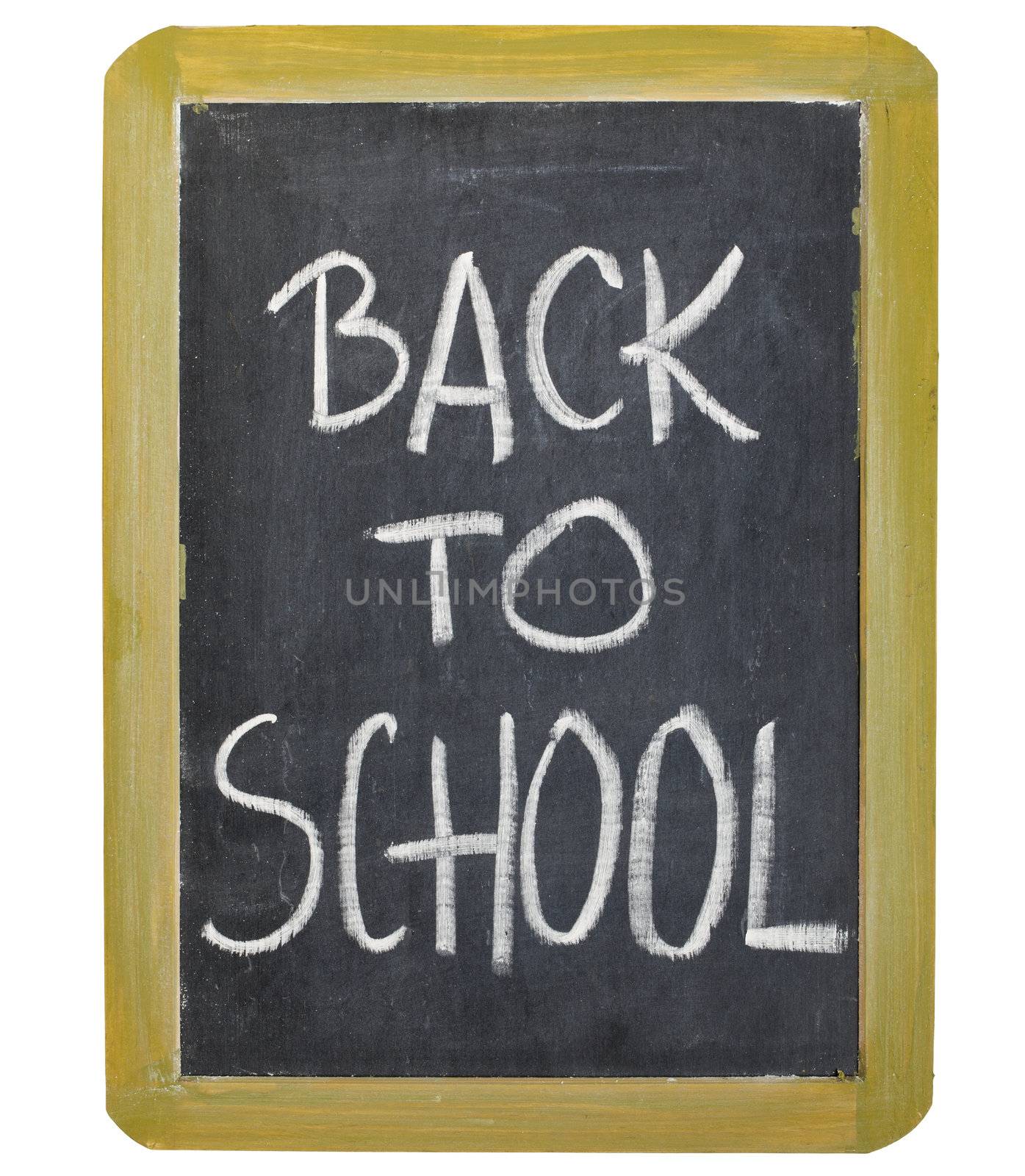back to school  - white chalk handwriting on a small grunge slate blackboard, isolated on white