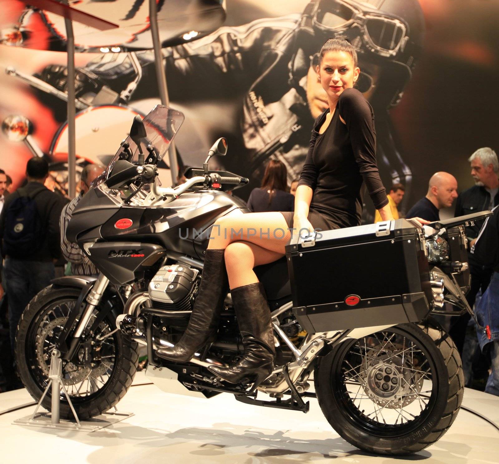 Looking at new motorcycles stands at EICMA, International Motorcycle Exhibition 2010 in Milan, Italy.