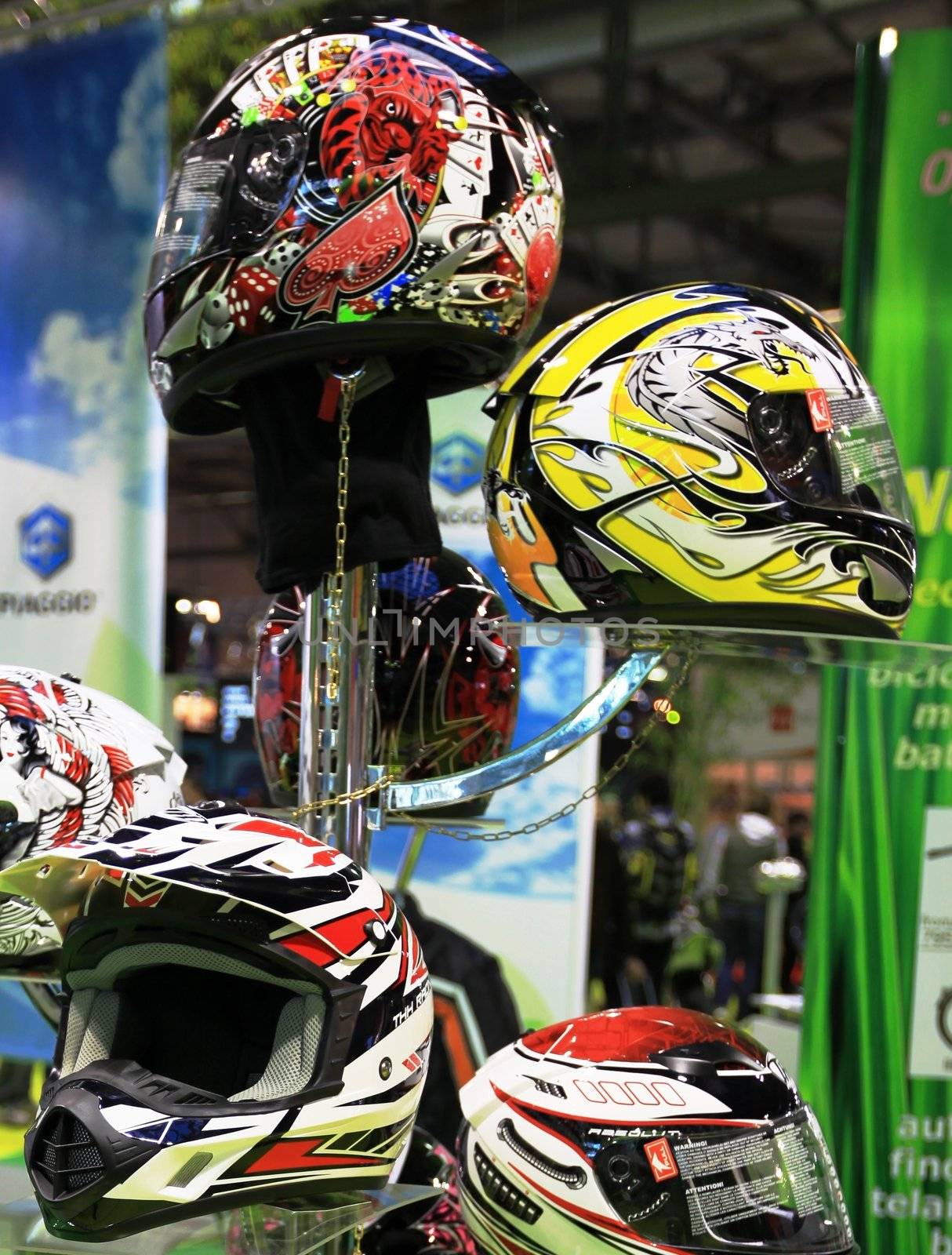 Looking at new motorcycles stands at EICMA, International Motorcycle Exhibition 2010 in Milan, Italy.