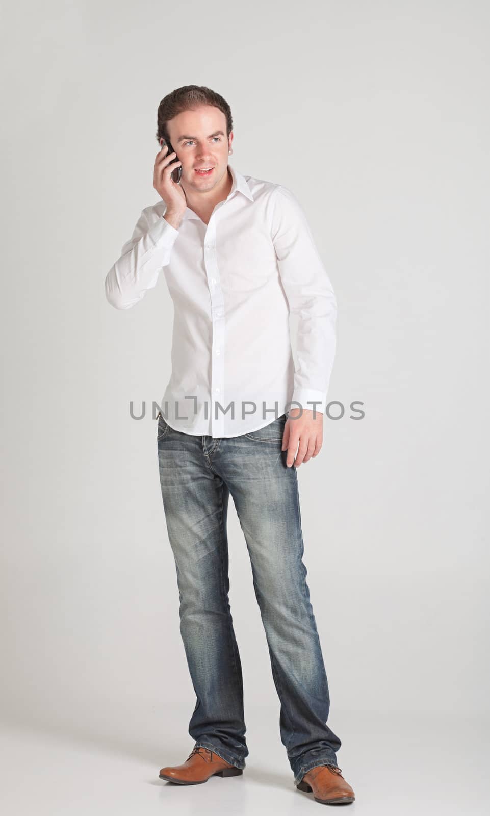 Portrait of young man talking on his cellphone