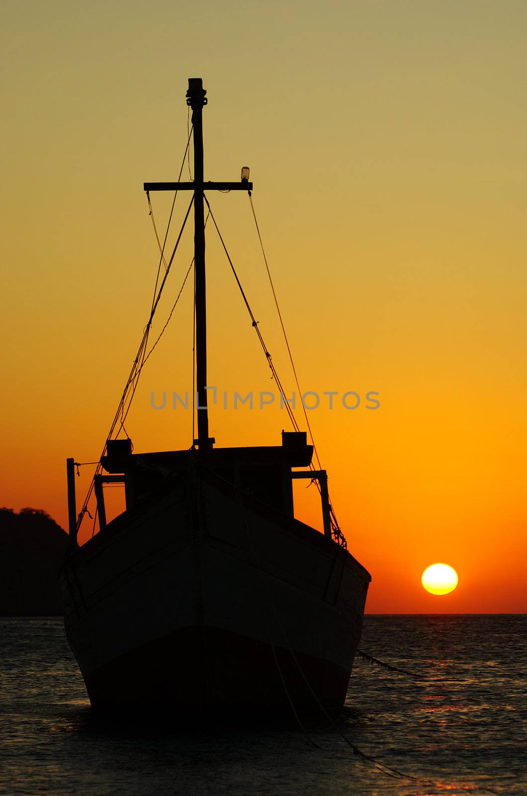 Fishing boat at sunset anchoring in the bay of Taganga on the Caribbean coast of Colombia