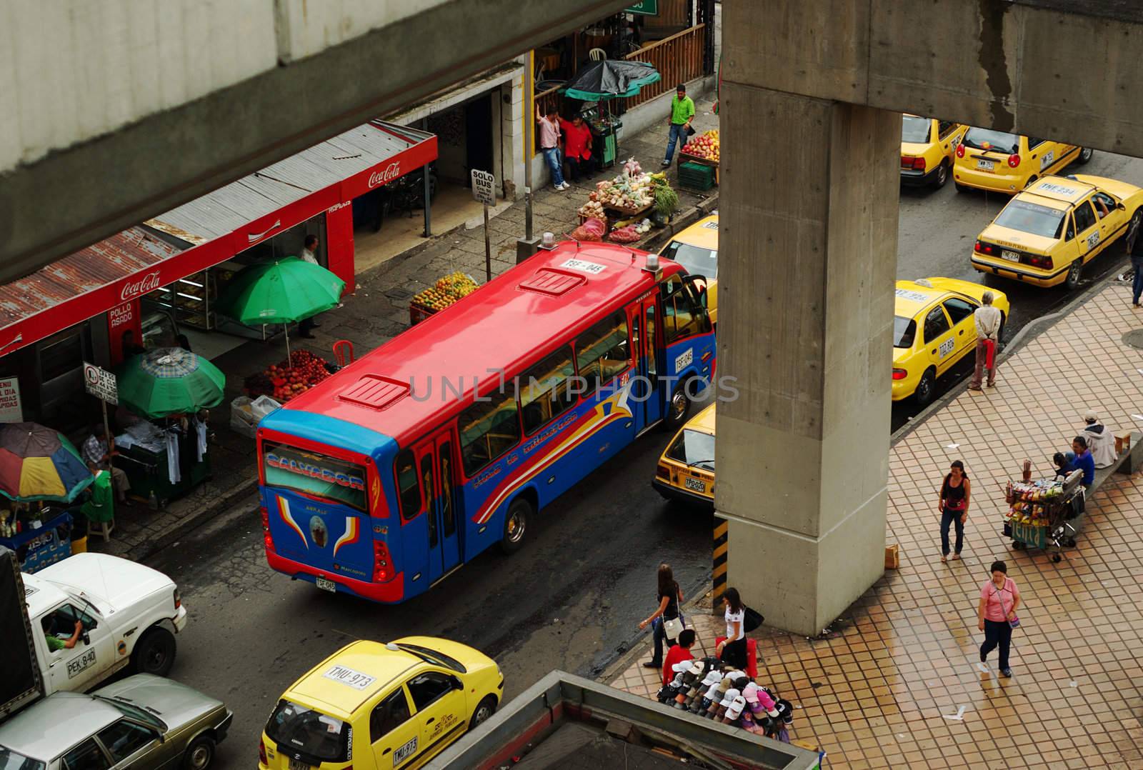 MEDELLIN, COLOMBIA - JANUARY 23: Typical street with buses and taxis on January 23, 2010 in downtown Medellin, Colombia. Buses, taxis are the most common public transportation form in South America.