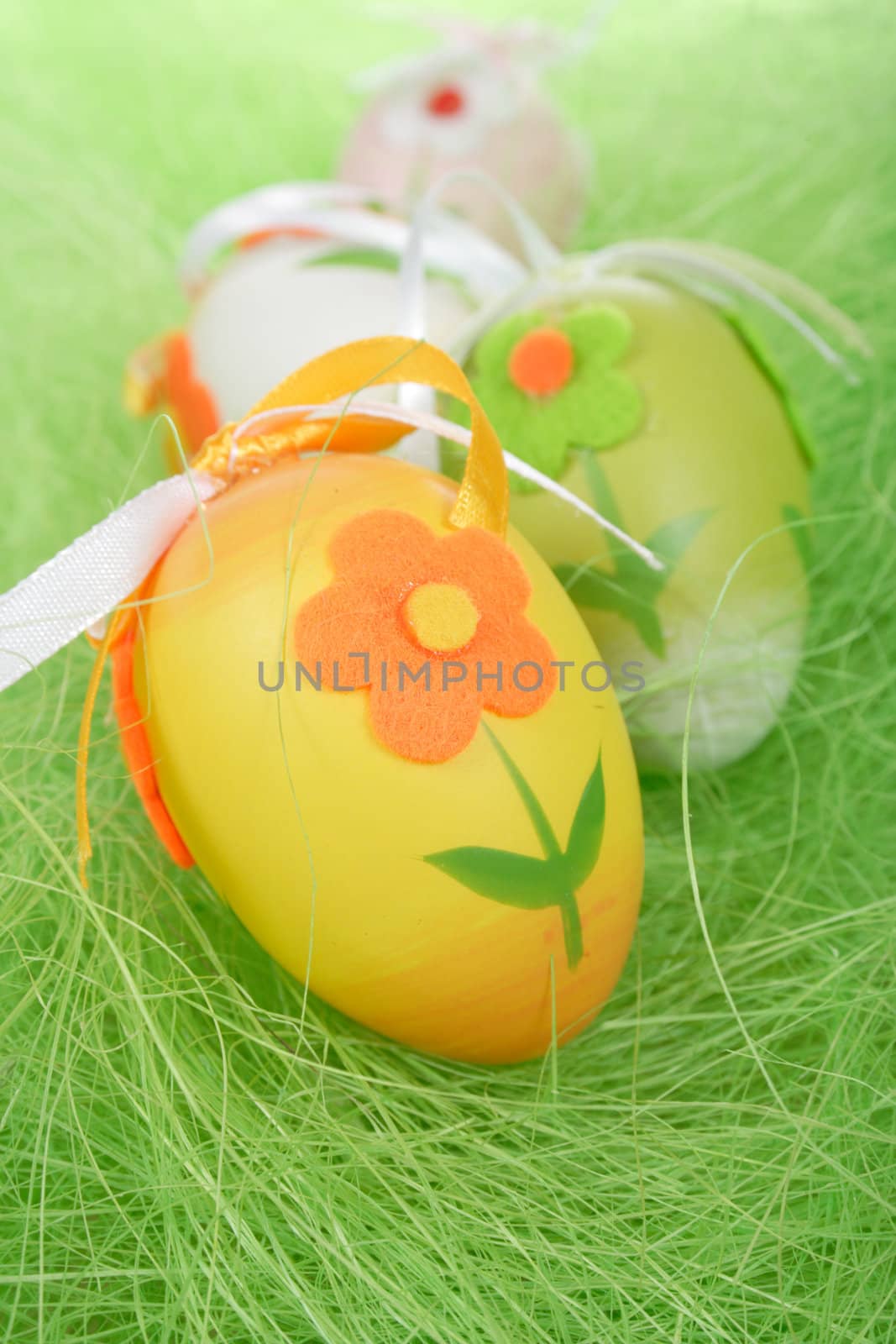 Painted Colorful Easter Eggs on green Grass