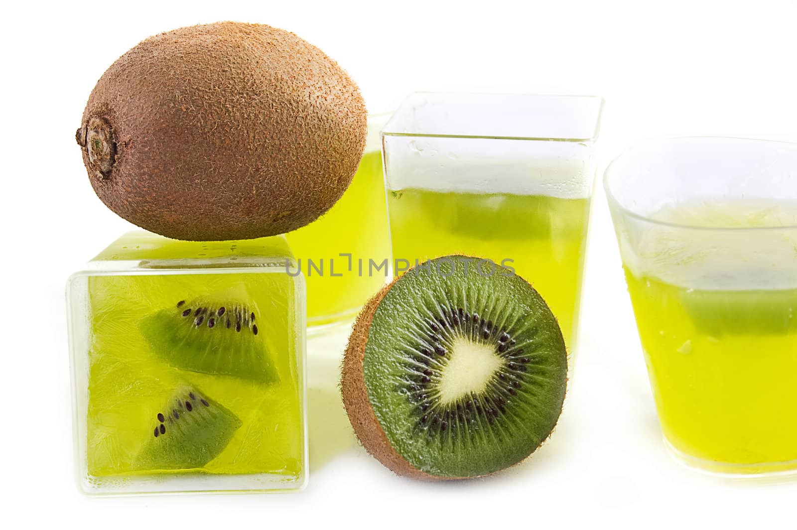 Green jelly in glass and kiwi over white