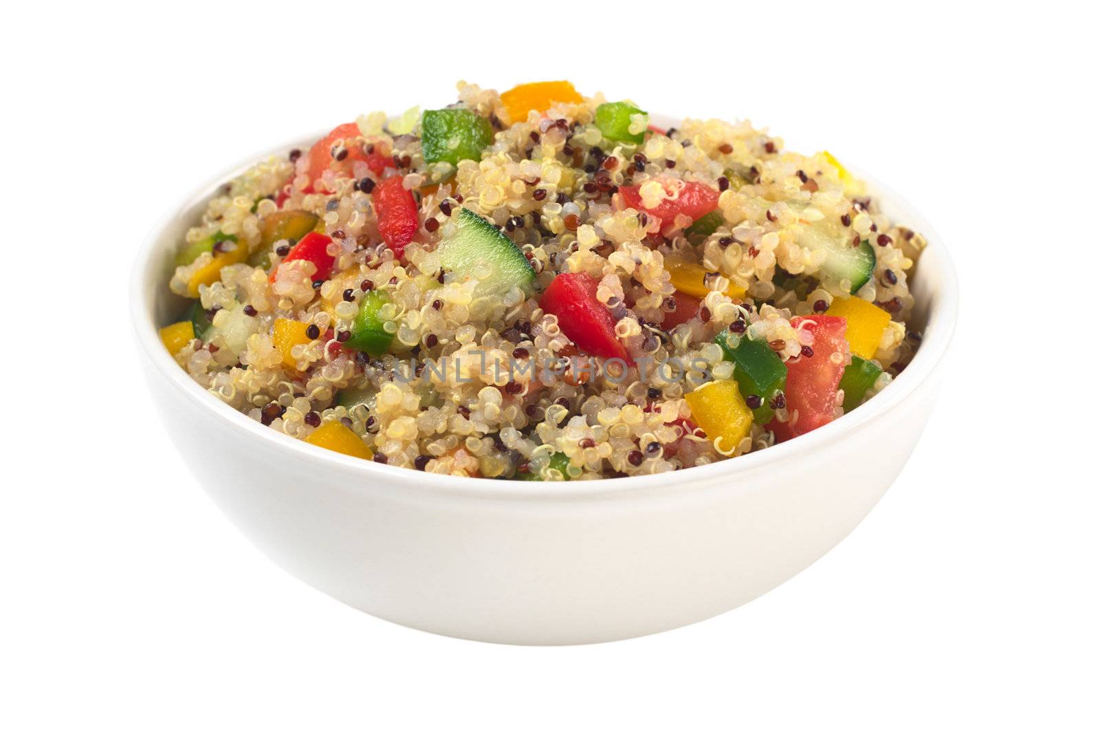 Delicious vegetarian quinoa salad with bell pepper, cucumber and tomatoes isolated on white (Selective Focus, Focus one third into the bowl) 