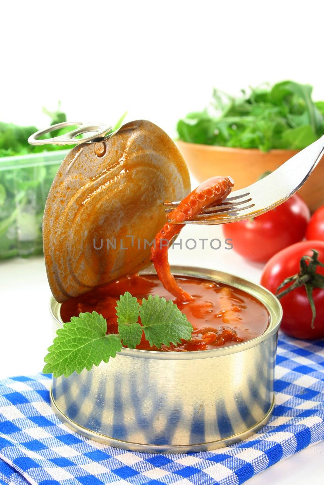 a tin of musk octopus in tomato sauce