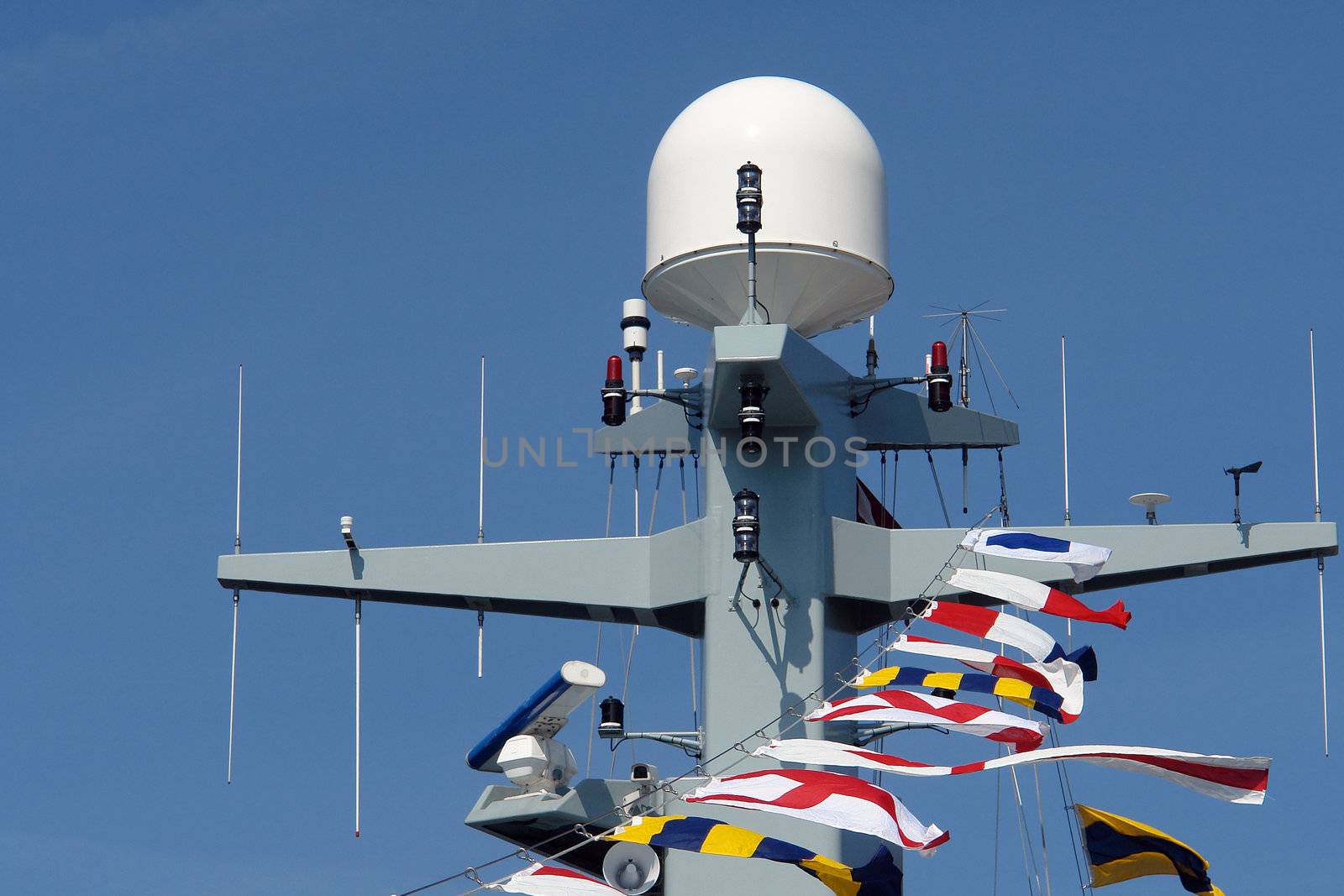 Close details of radar  system and communication tower on a navy patrol frigate