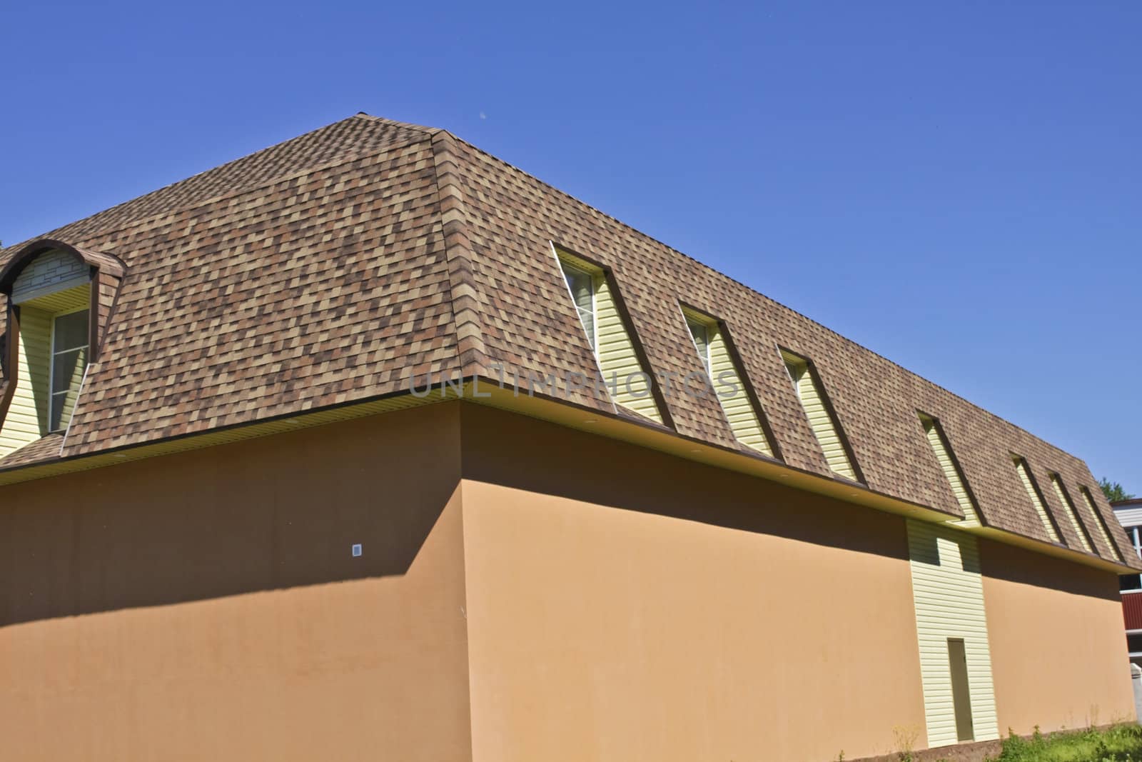 newly built, modern, American-style house with a tiled roof