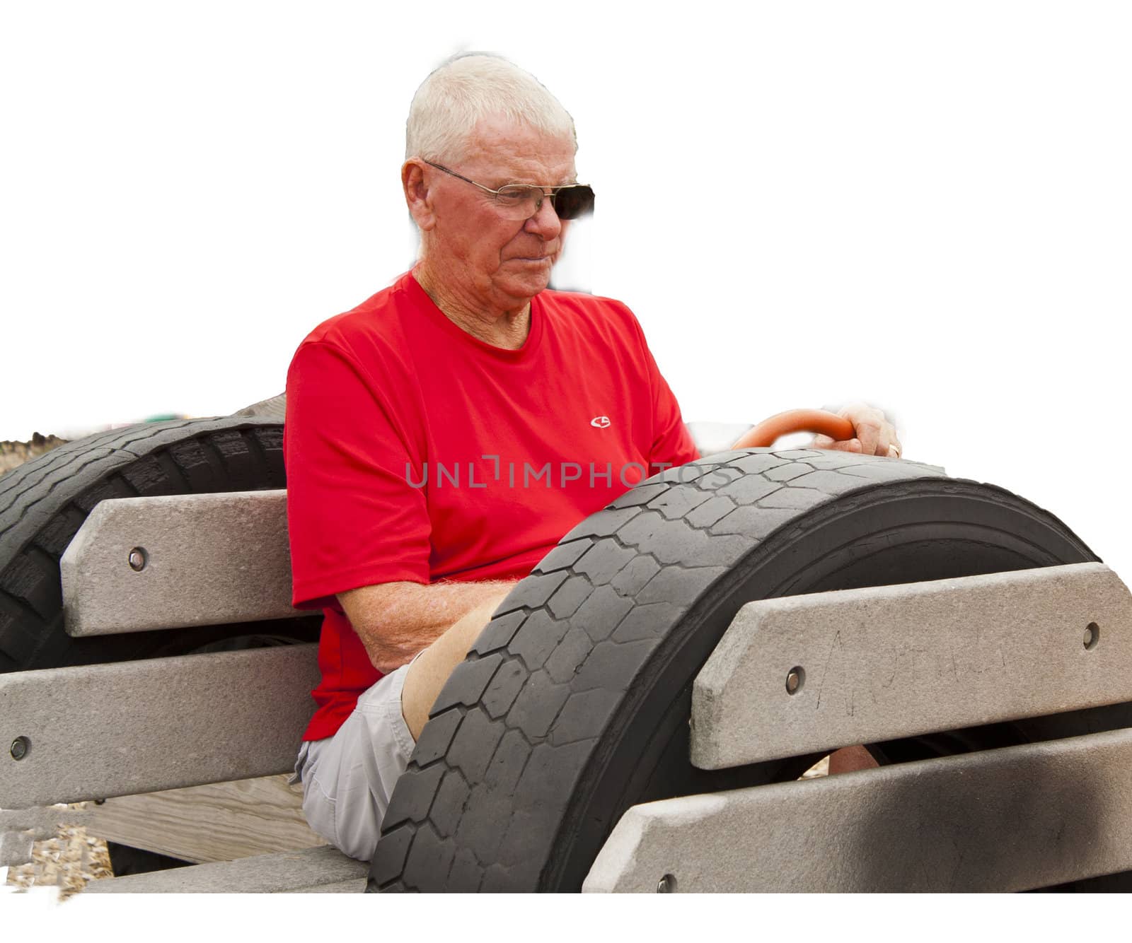 Grandfather sitting in playground car