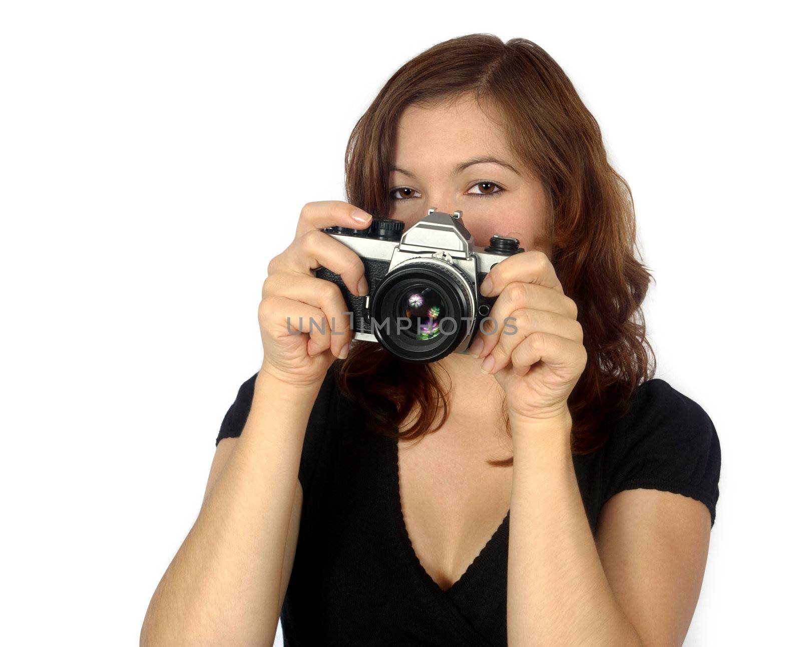 Beautiful female photographer / tourist pointing a camera.

