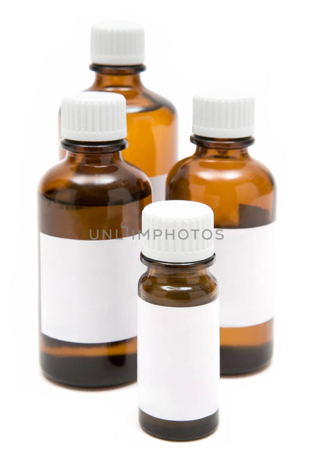 Several medicine bottles with blank labels isolated on a white background.