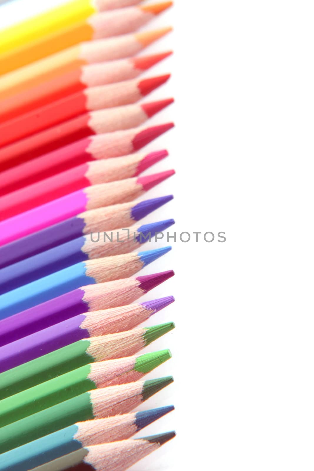 rainbow color pencils with copy-space isolated on white background