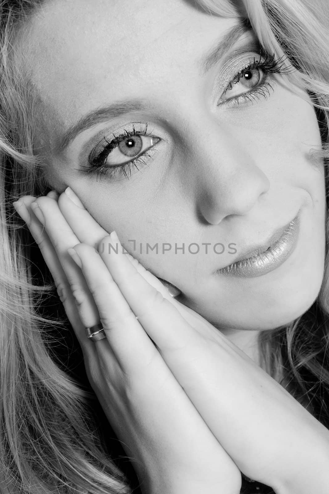 Studio portrait of a long blond girl resting