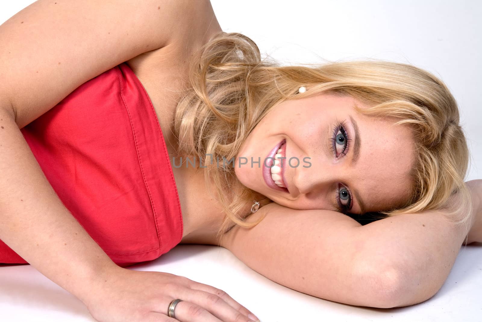 Studio portrait of a long blond girl lying