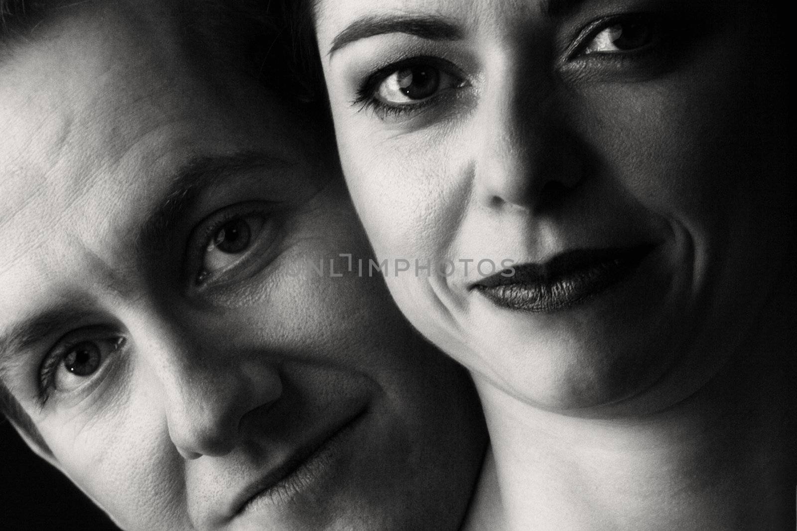Married lovers portraits taken in the photo studio close up in black and white