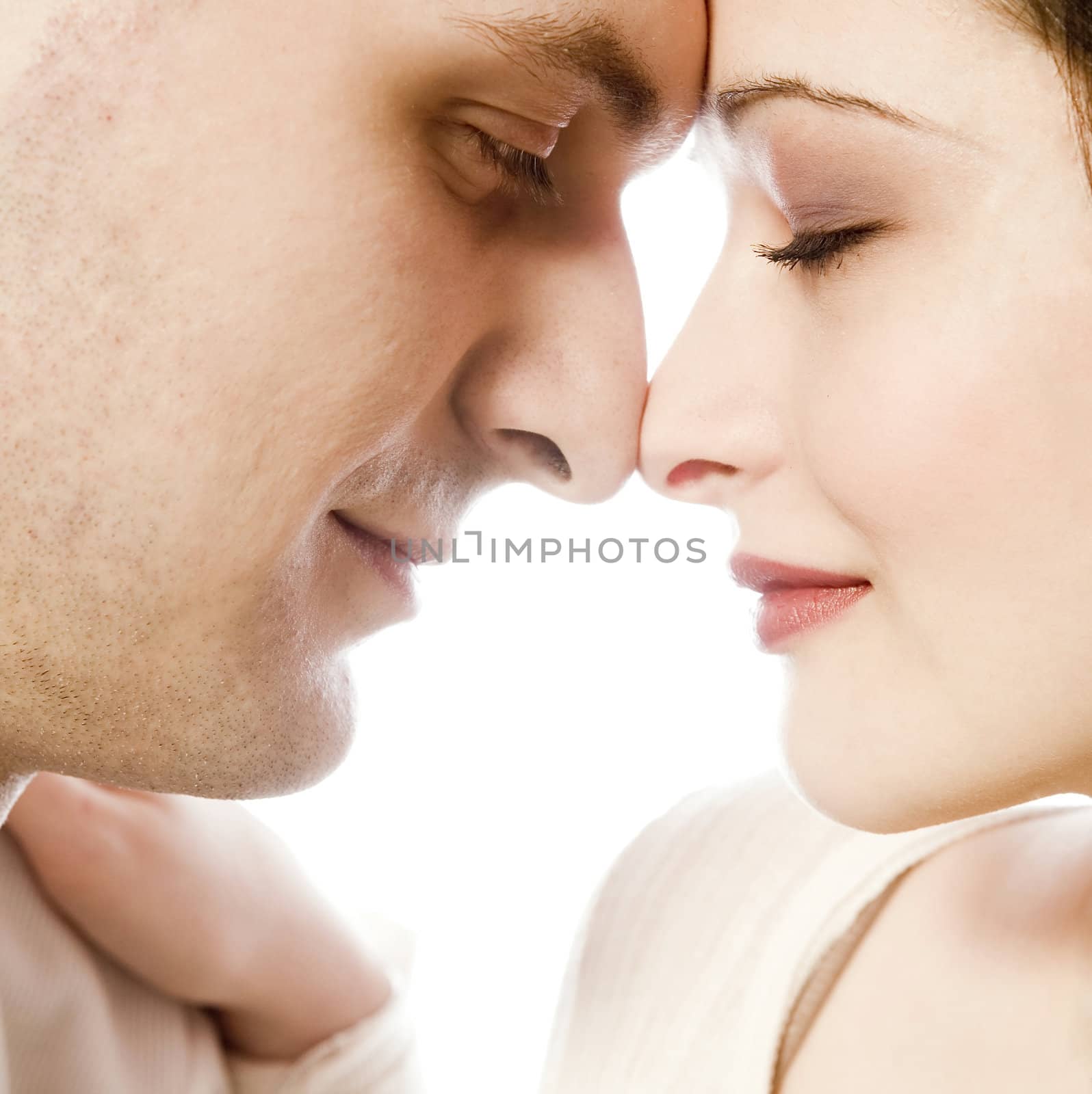 Studio portrait of loving young couple