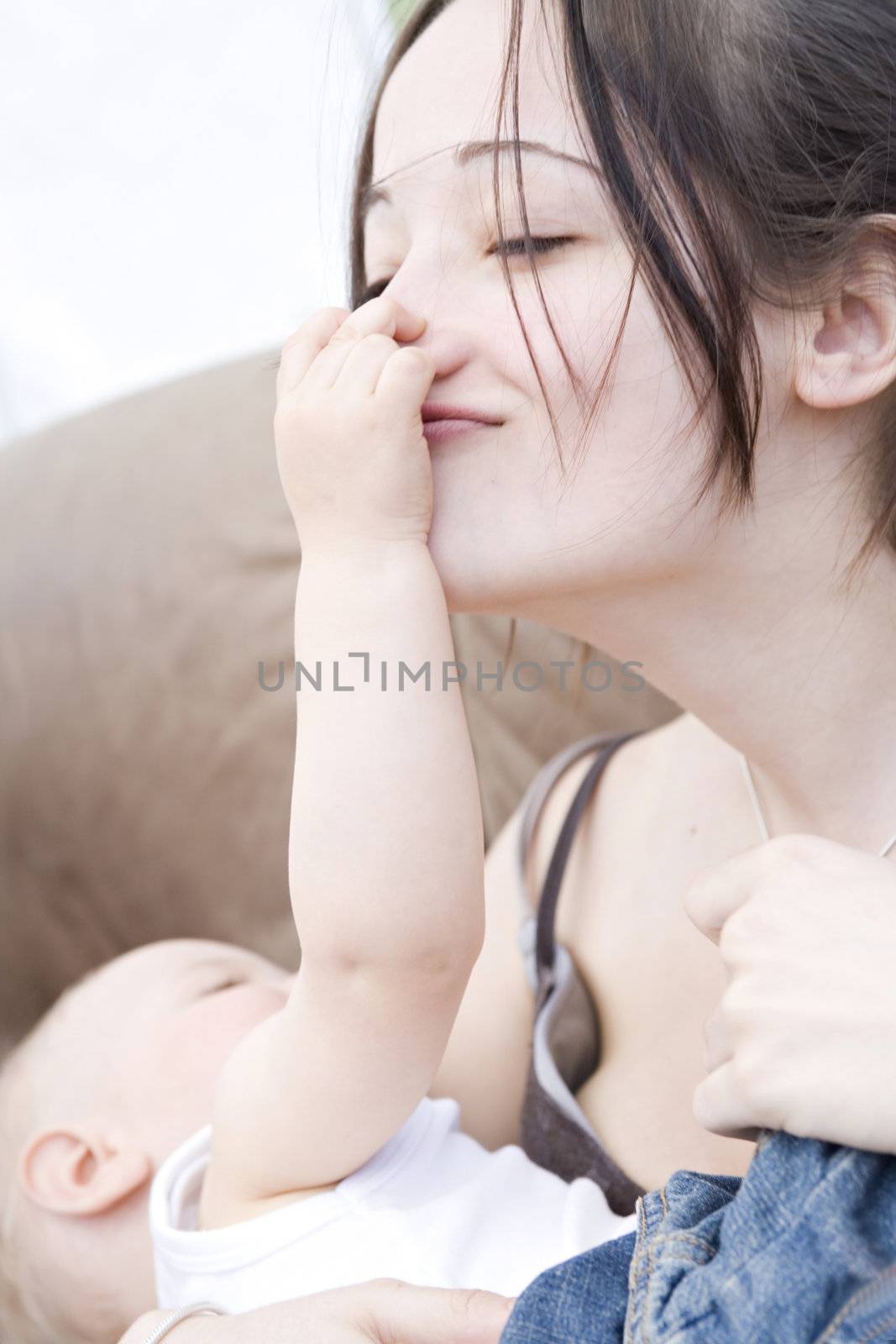 Pretty young brunette and baby son playing by DNFStyle