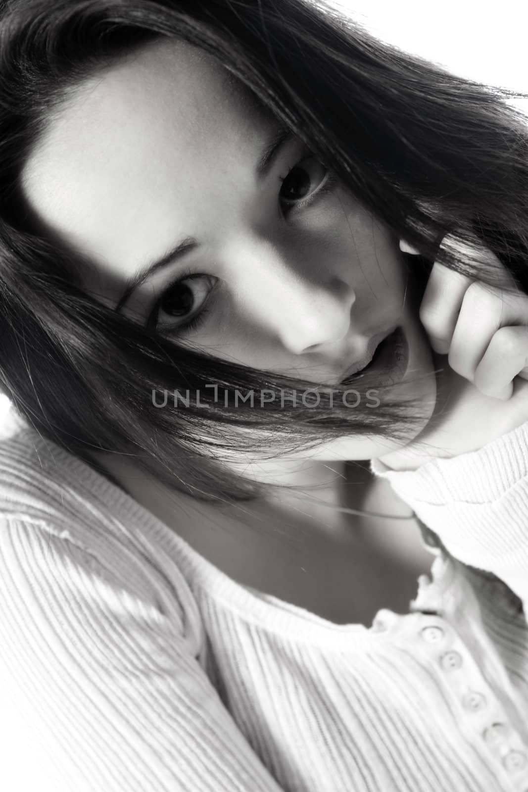 Pretty young brunette looking pensive by DNFStyle