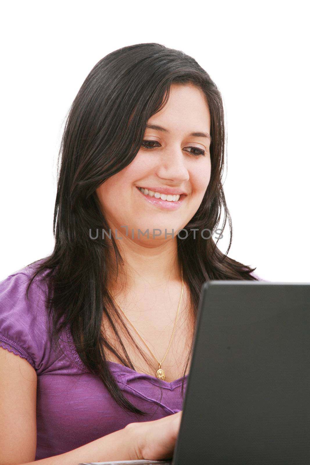 Portrait of a beautiful young woman working on laptop