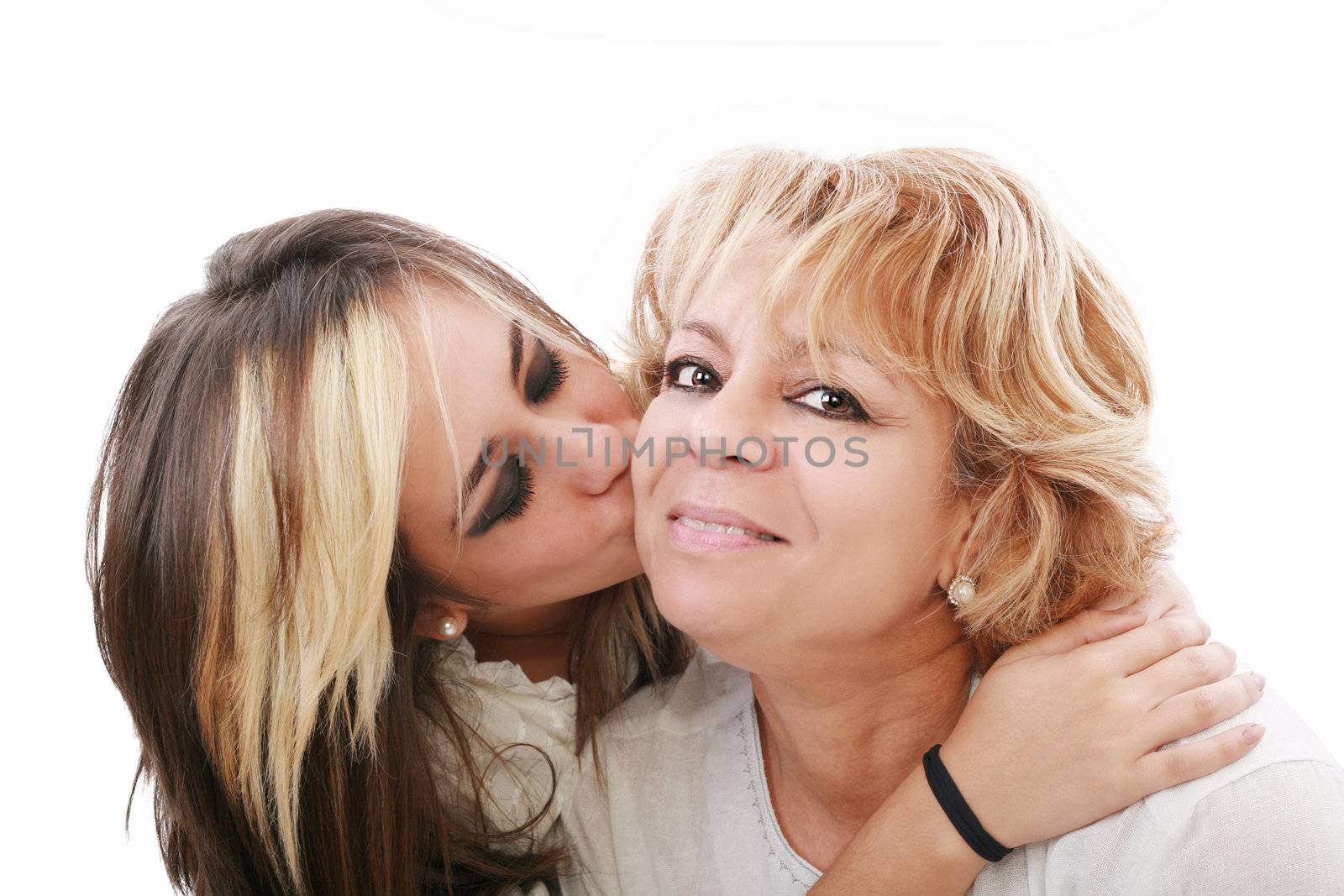 Closeup of young girl kissing her mom isolated on a white backgr by dacasdo