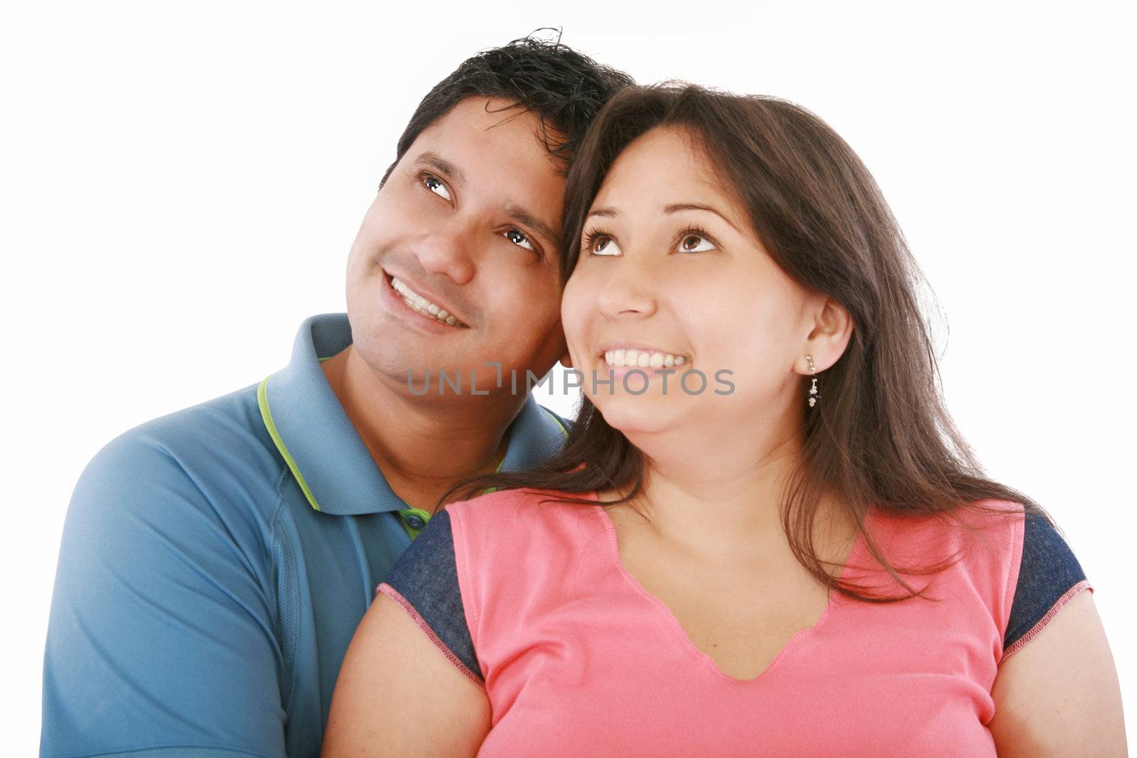 Closeup portrait of a happy couple looking at something interesting