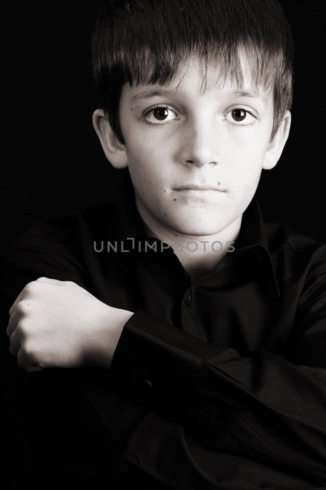 Young boy with big eyes in casual attire