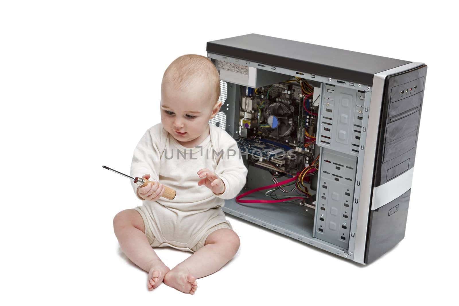 young child working on open computer by gewoldi