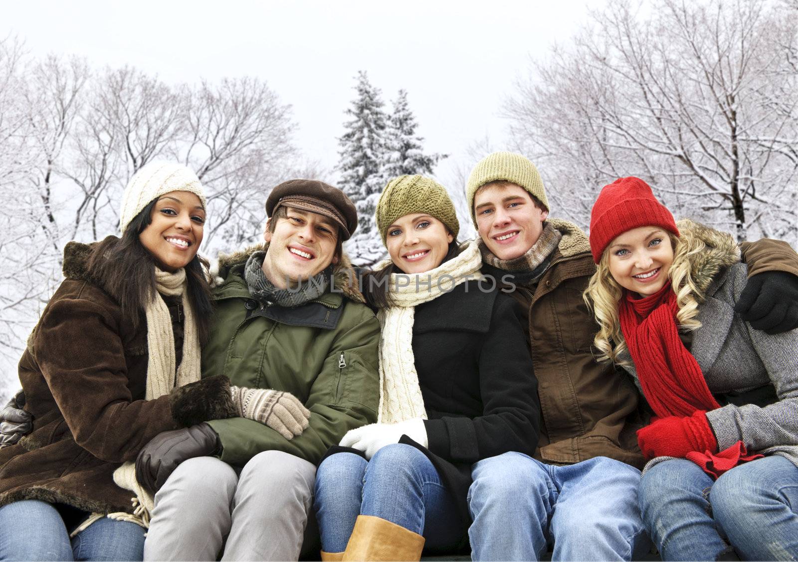 Group of diverse young friends outdoors in winter