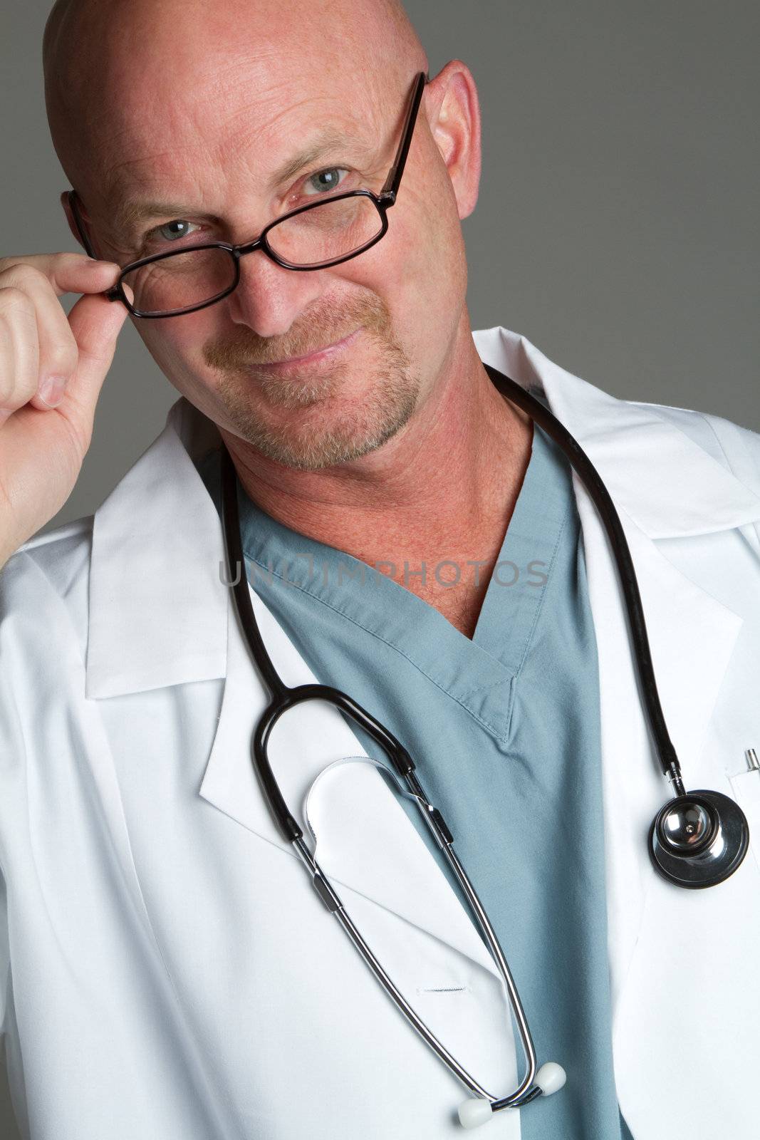 Handsome smiling doctor wearing glasses