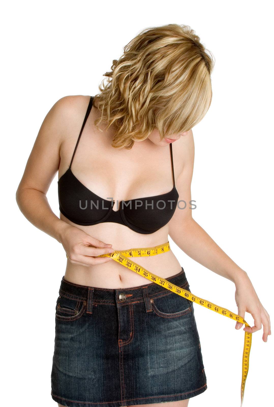 Woman measuring weight loss waist