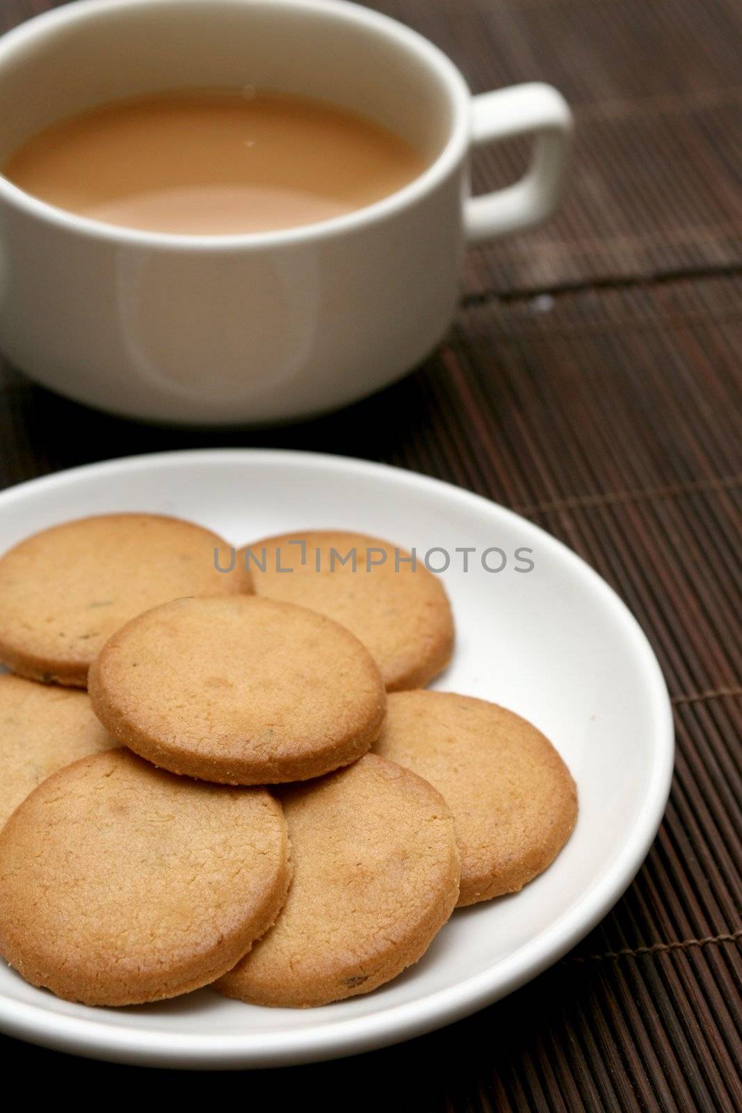 Cup of tea with biscuits by haiderazim