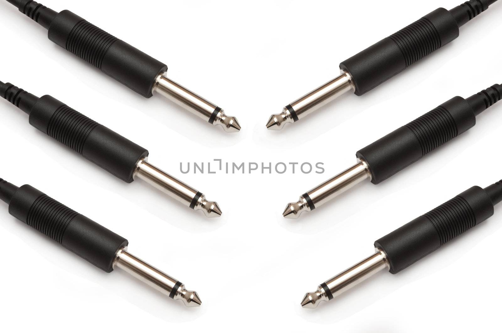 Close up capturing several Jack Plugs arranged over white