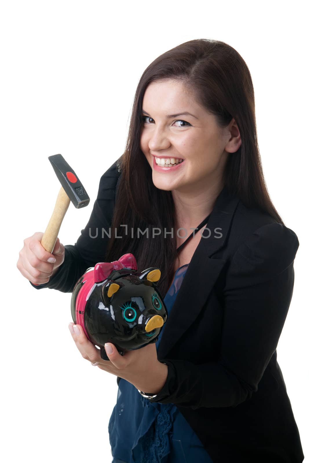 a young adult woman holding a pig bank and a hammer smiling