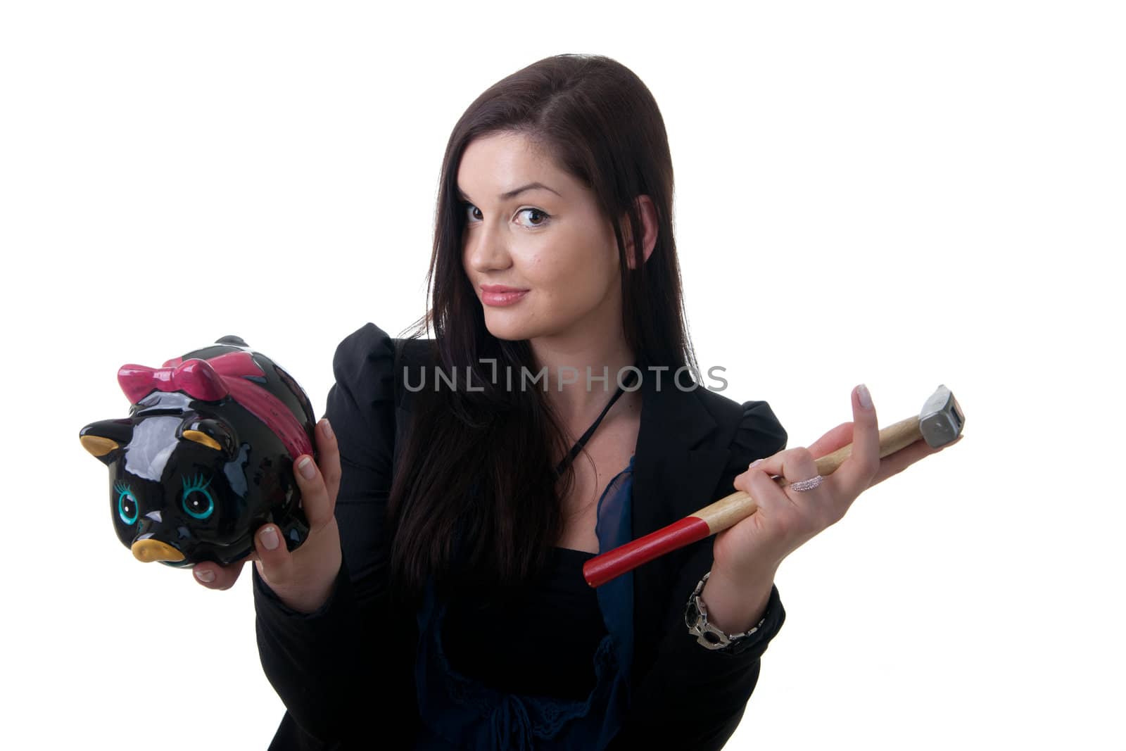 a young woman holding a piggy bank and a hammer looking unsure