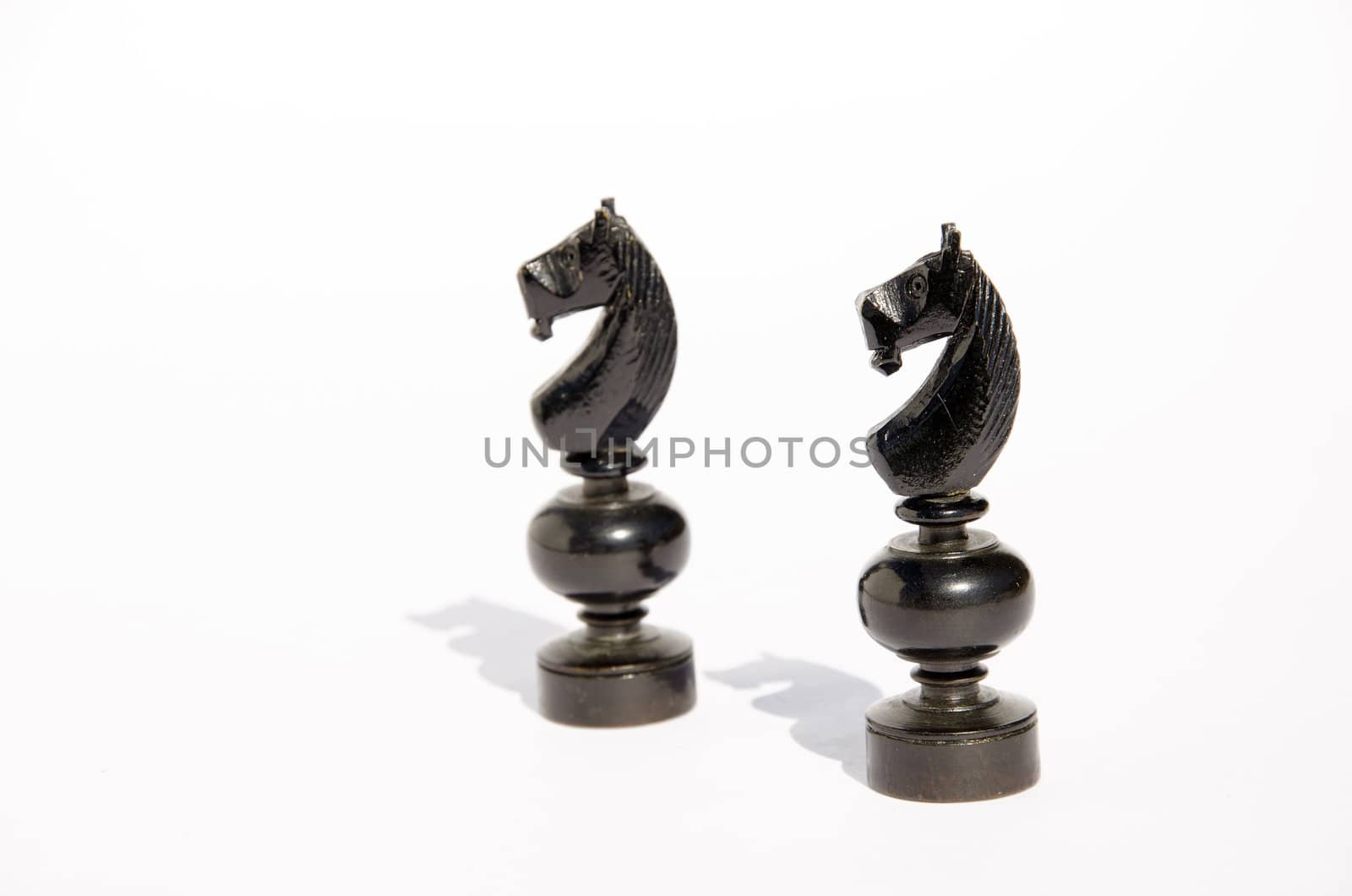 Few chess figures - horse isolated on a white background.