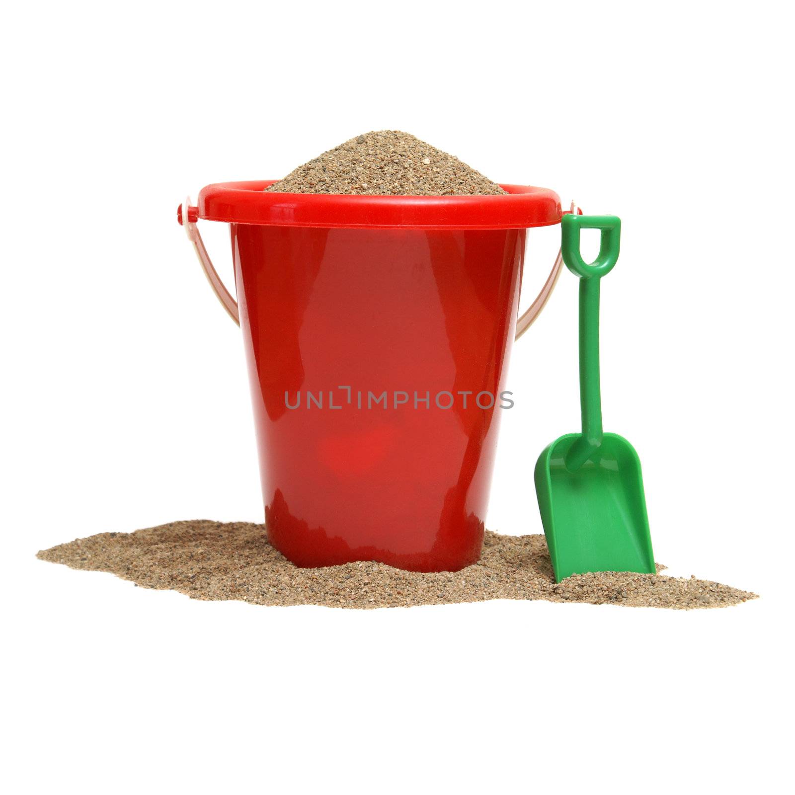 An isolated shot of a bucket of sand for the childrens play time either on vacation, at the beach, or just at home in the sandbox.