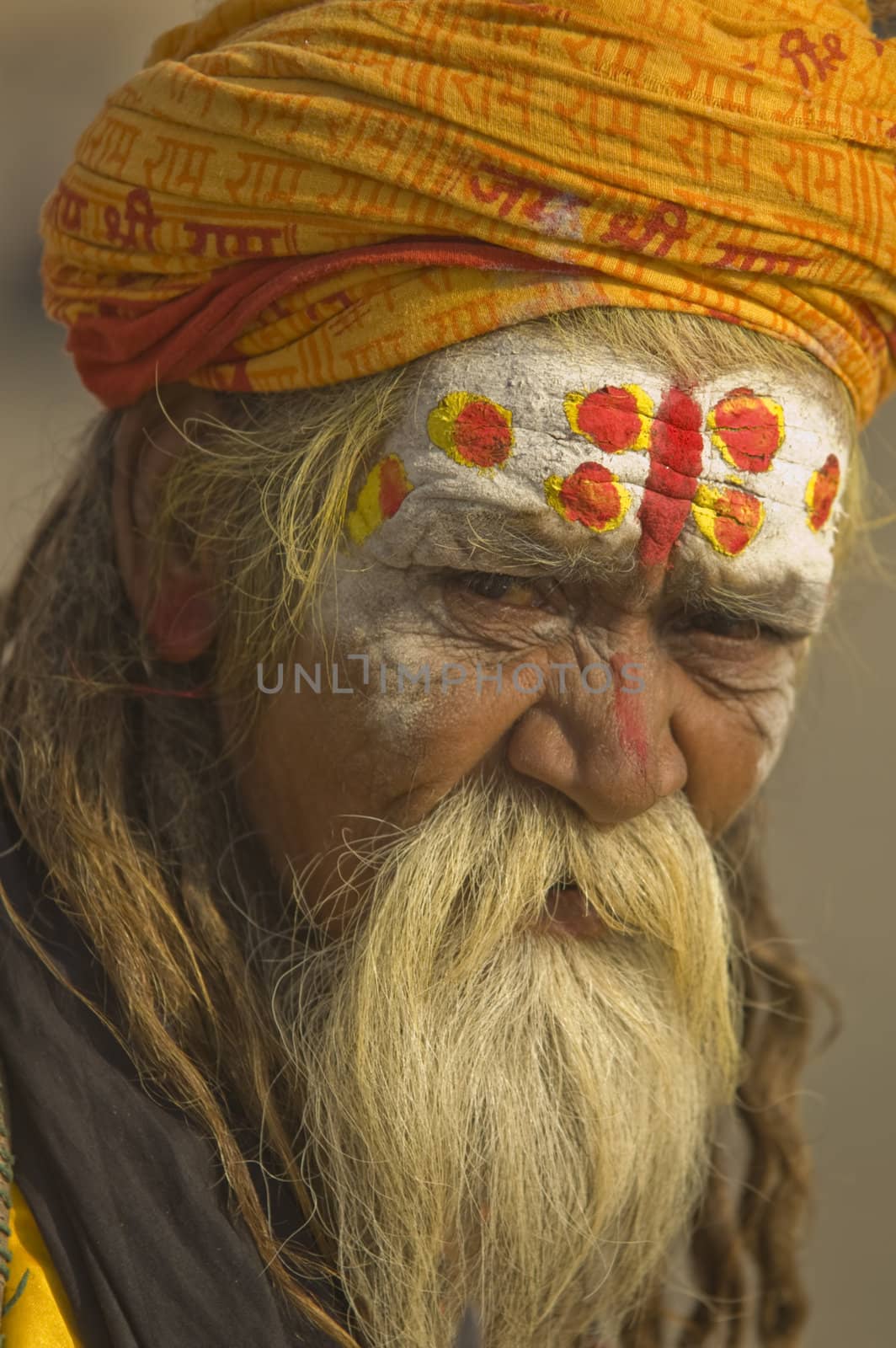 Hindu Sadhu. Man with beard and painted face in the sacred city of Varanasi, Uttar Pradesh, India