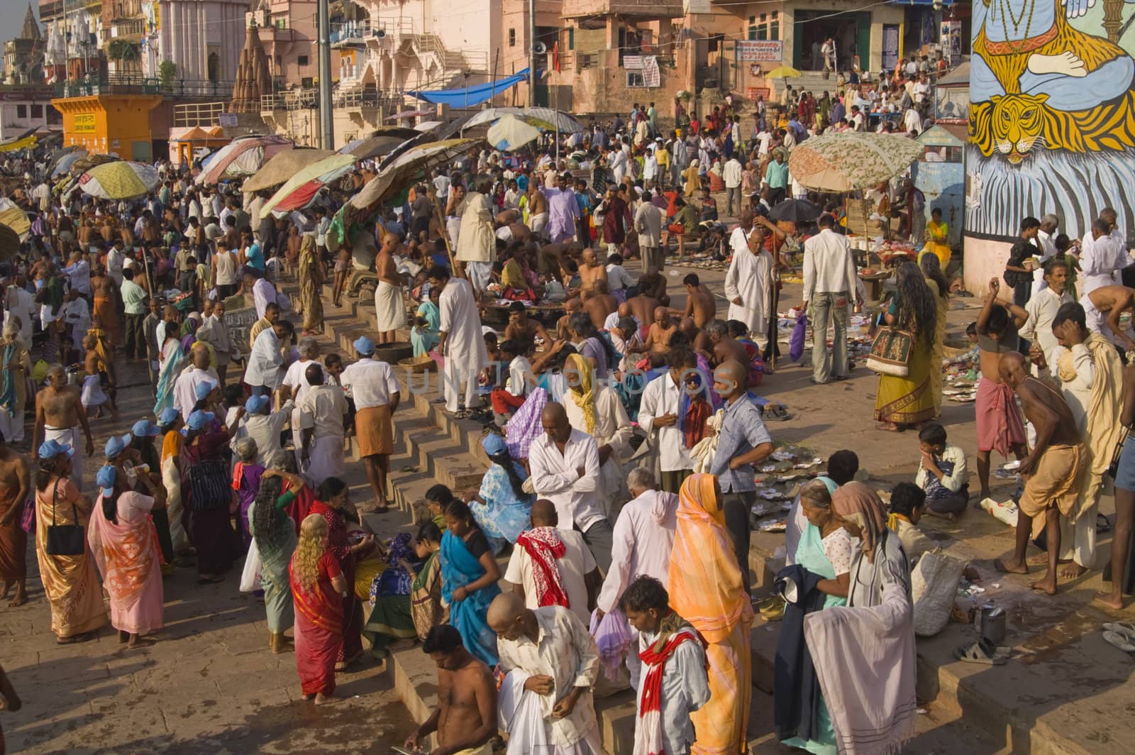 Crowds of people bathing in the River Ganges in the sacred city of Varanasi, Uttar Pradesh, India