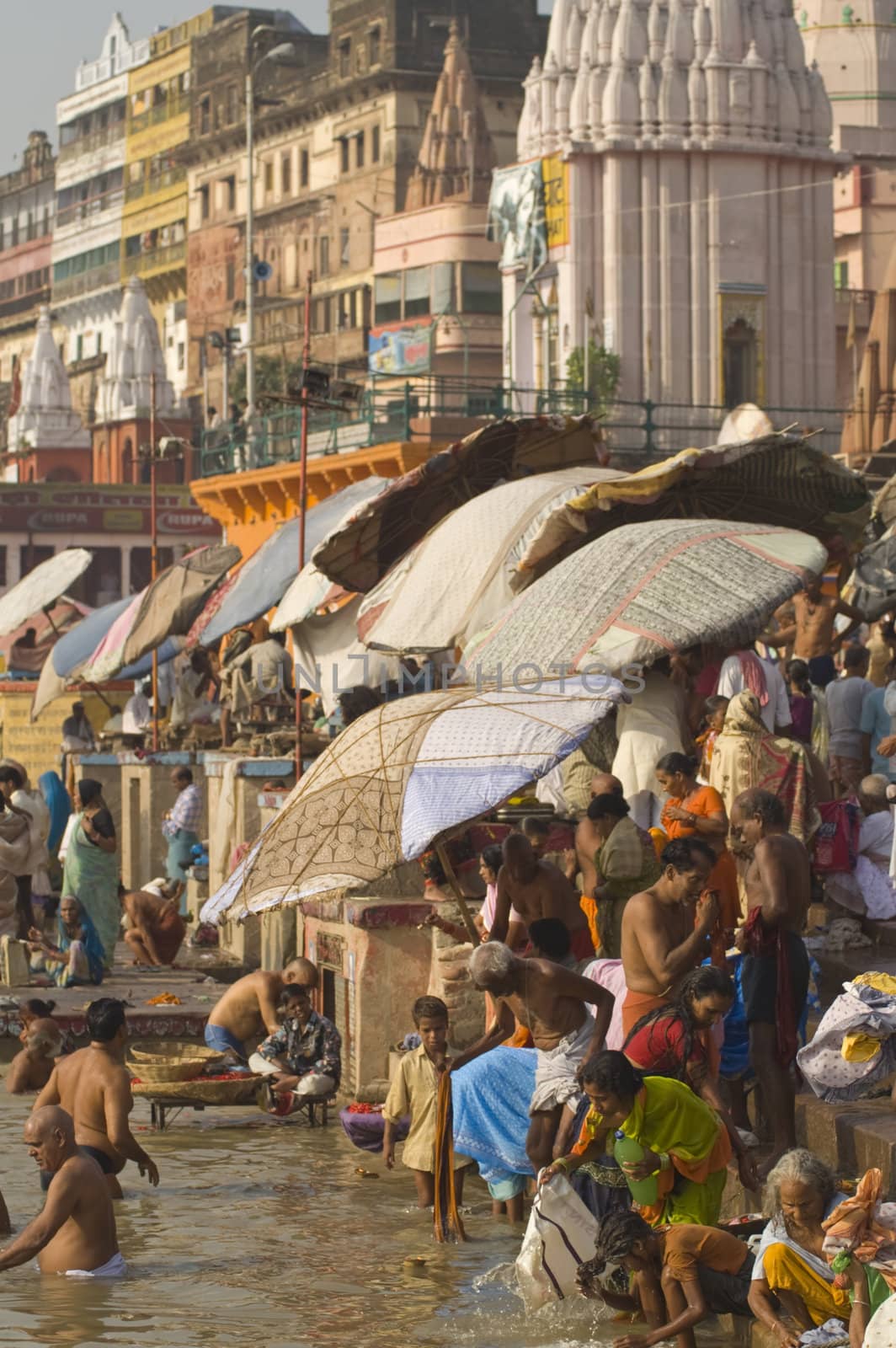 Crowds of people bathing in the sacred River Ganges in the sacred city of Varanasi, Uttar Pradesh, India